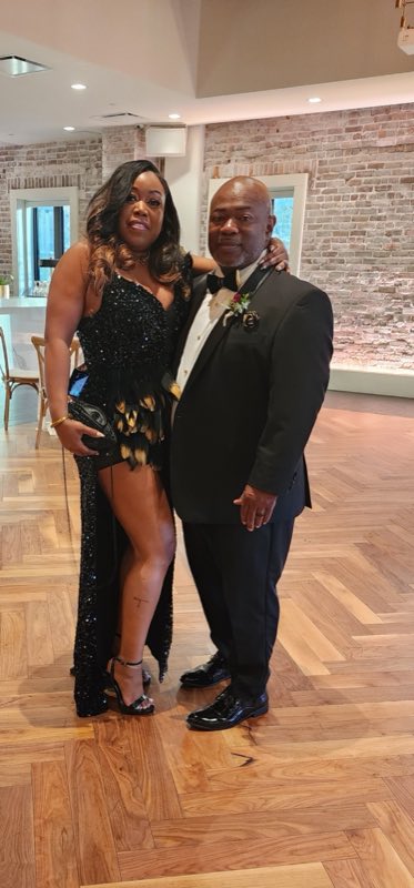Well-dressed couple in formalwear at an event