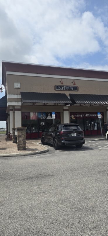 Josey's Alterations storefront on Fortune Road, Kissimmee, with gowns in the window