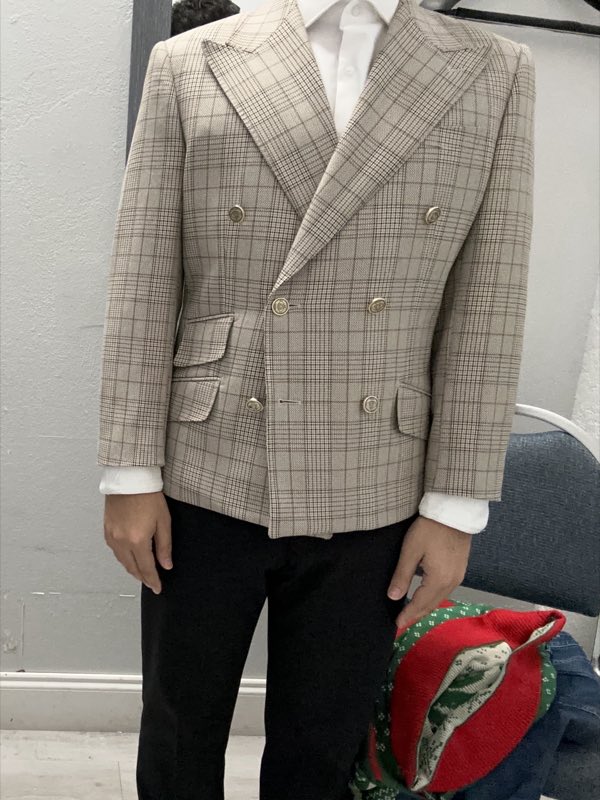 Tailored houndstooth double-breasted blazer on a client during a fitting